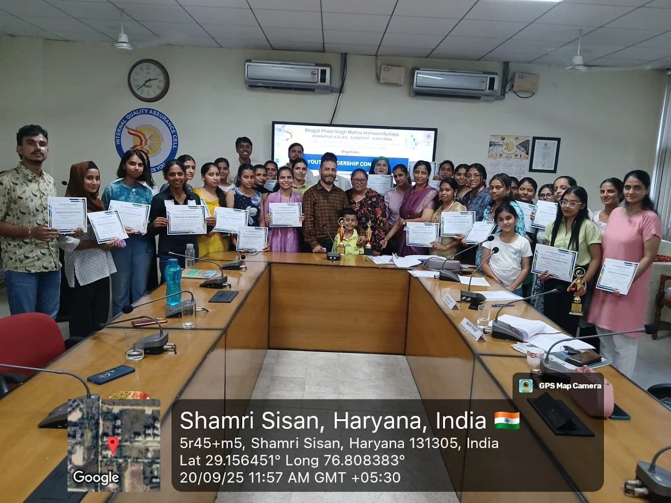 Participants holding certificates of participation at a youth leadership conclave.